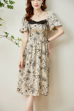 Load image into Gallery viewer, Bjorg floral front ribbon printed satin dress with gathered back and elastic waist
